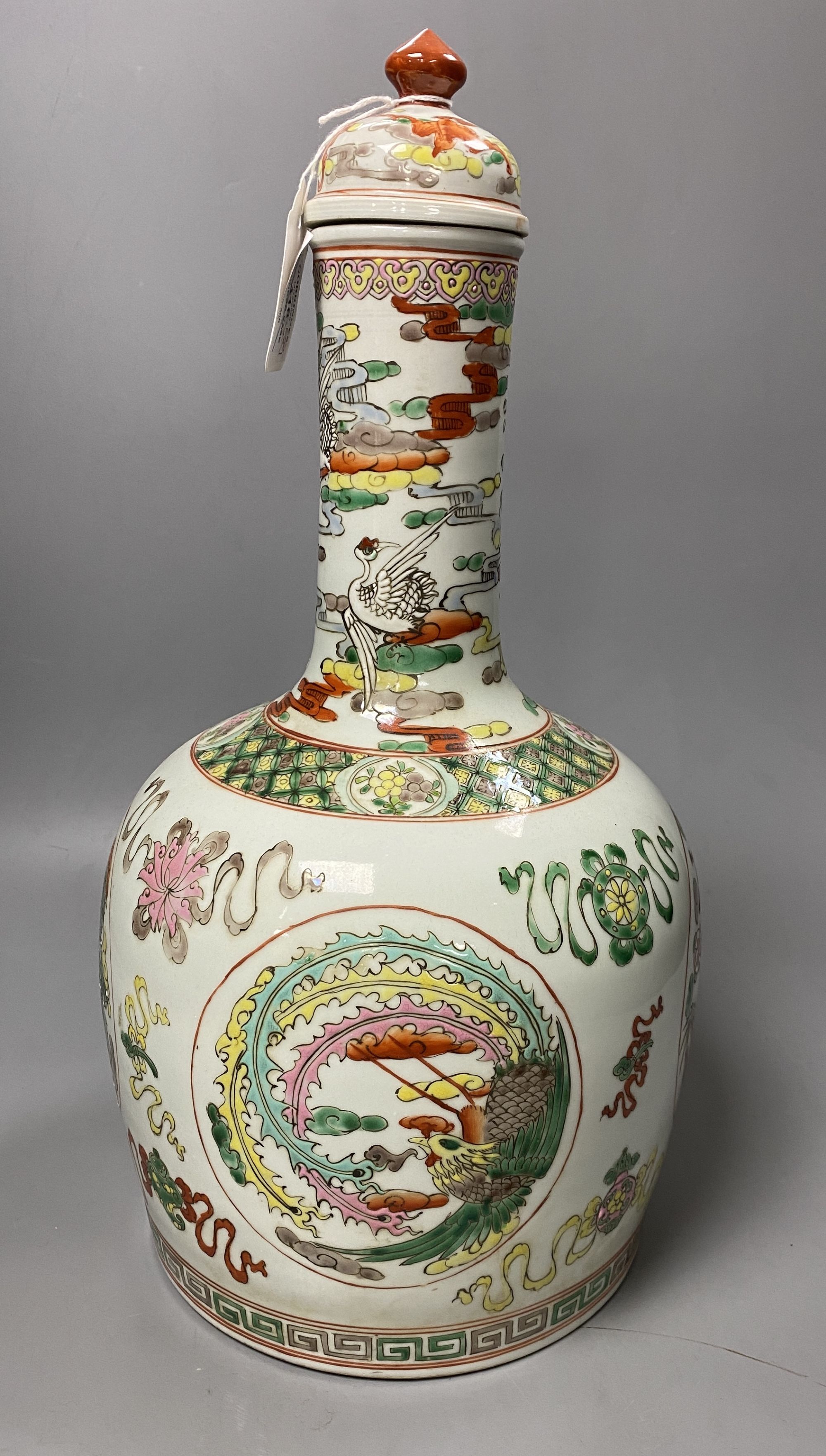 A Chinese famille rose dragon and phoenix bottle vase and cover, 42cm